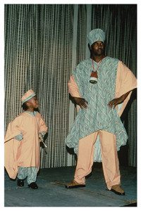 A man and child in costume on stage.