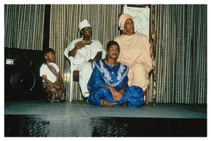 A group of people sitting on the stage